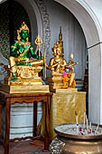 Thailand, Phra Pathom Chedi, the nation's largest pagoda in Nakorn Pathom. Buddha statue in niche of the outer courtyard.